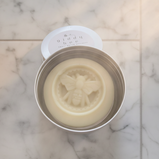 Handmade beeswax solid lotion bar, crafted in small batches with natural ingredients like herb-infused oil, shea butter, and beeswax for deep hydration and skin nourishment.