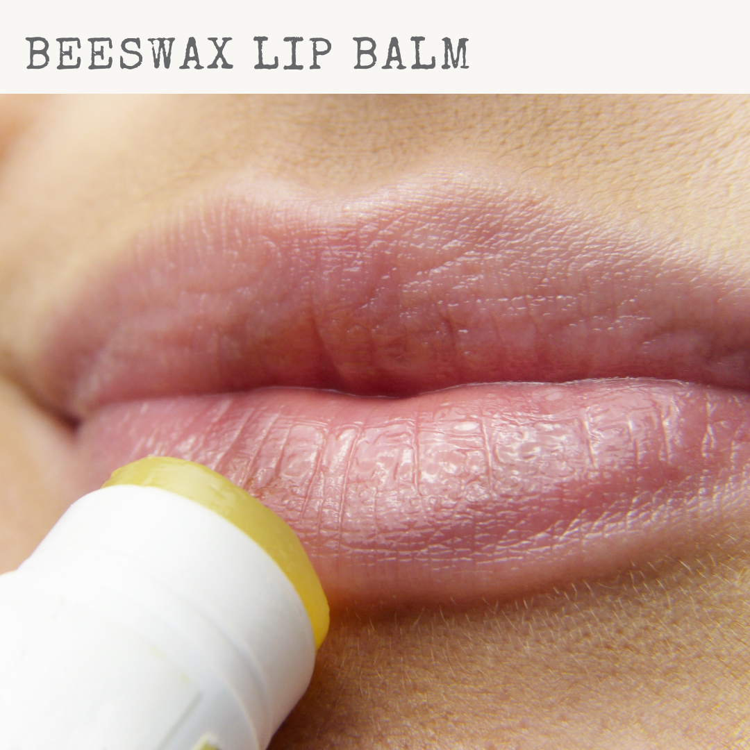 Open push up tube showing solid beeswax lip balm texture