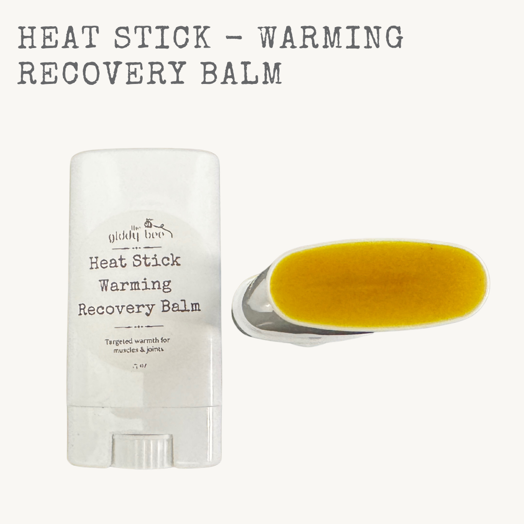 Heat Stick warming recovery balm in a push-up tube made with beeswax and botanical oils for sore muscles and stiff joints